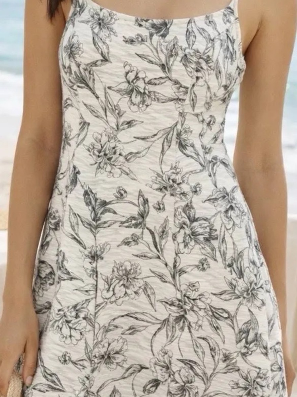A New Day cream mini dress features a black floral print and spaghetti straps